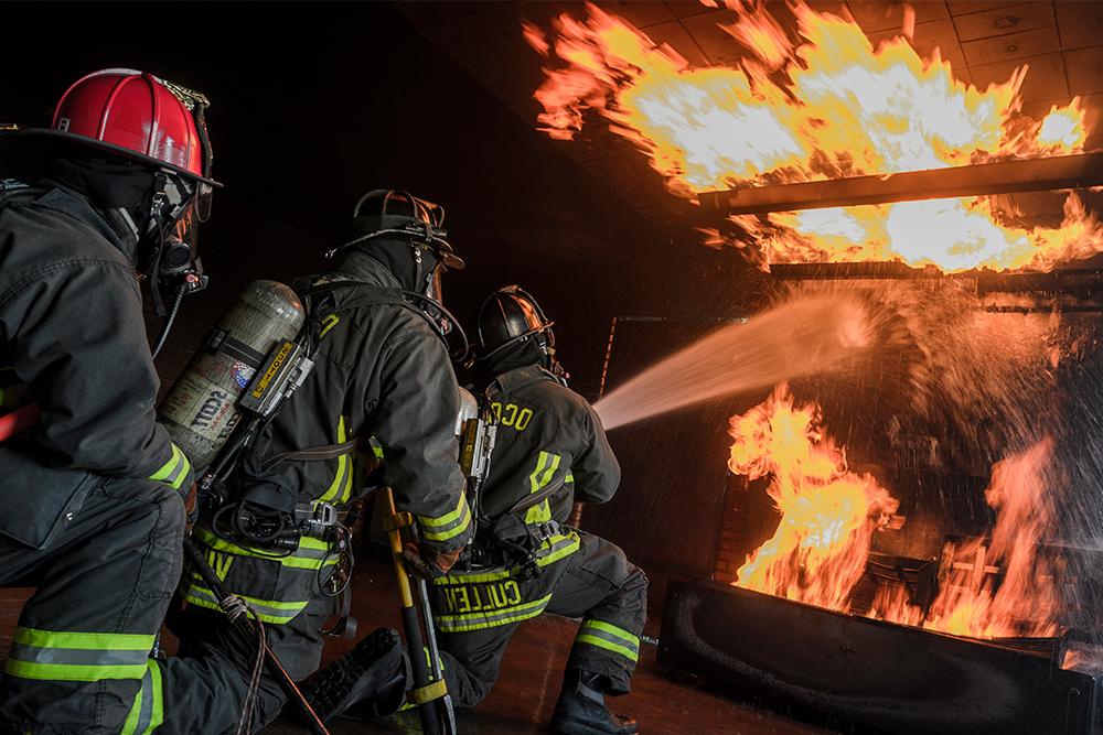 Fire Sciences training center firefighers extinguishing flames